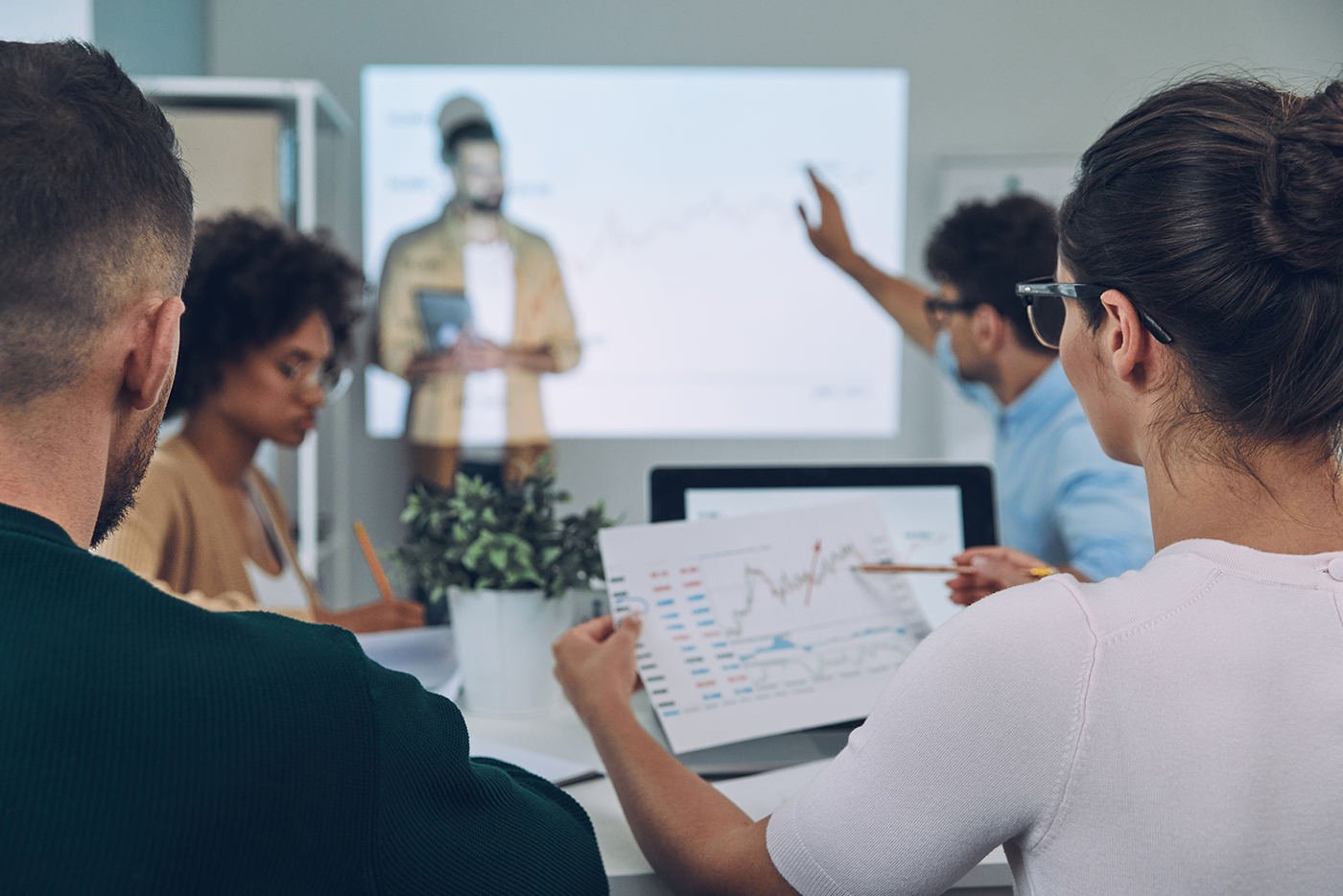Business colleagues discussing charts
